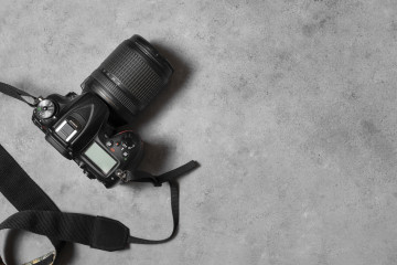 Top view photo camera indoors still life